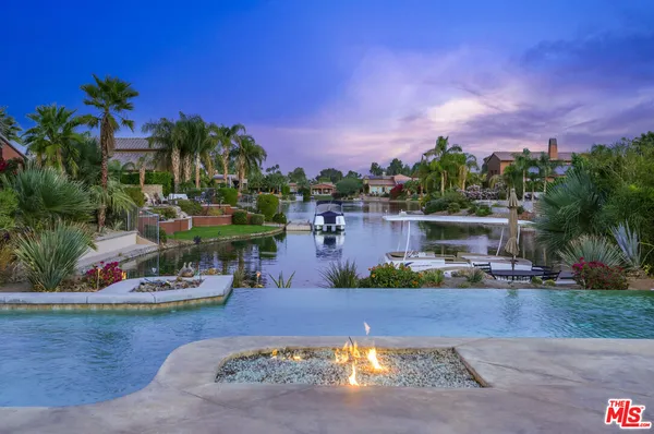 a view of a swimming pool and lounge chair