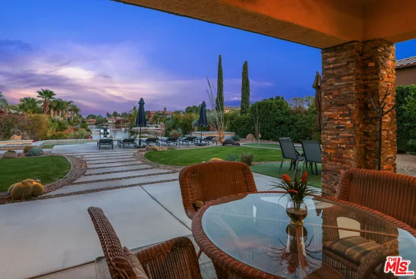a view of a chairs and table in the patio