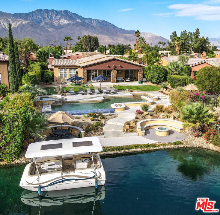 98 Via Santo Tomas Drive Rancho Mirage, CA 92270 - Photo 16 of 45 a view of a lake with a mountain