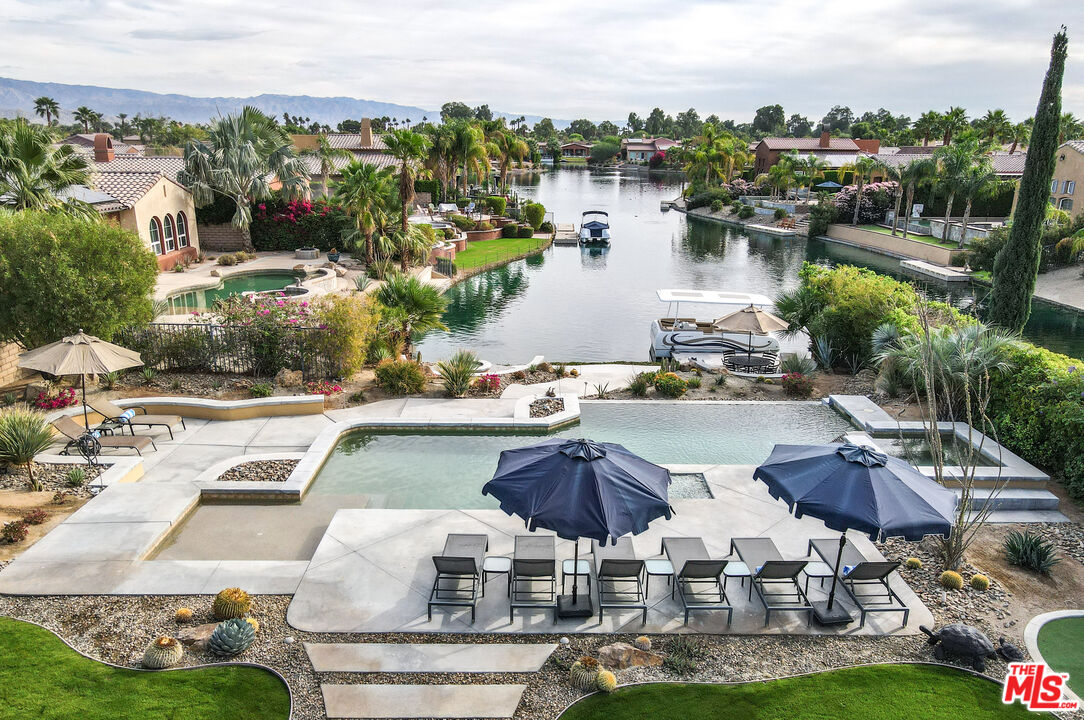 98 Via Santo Tomas Drive Rancho Mirage, CA 92270 - Photo 17 of 45 a picture of houses with outdoor space and lake view