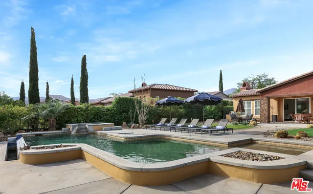 a view of a swimming pool with a patio
