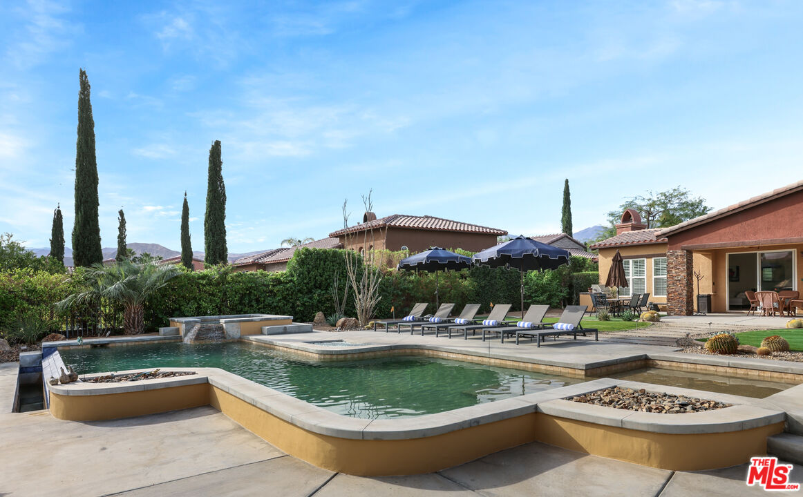 98 Via Santo Tomas Drive Rancho Mirage, CA 92270 - Photo 20 of 45 a view of a swimming pool with a patio