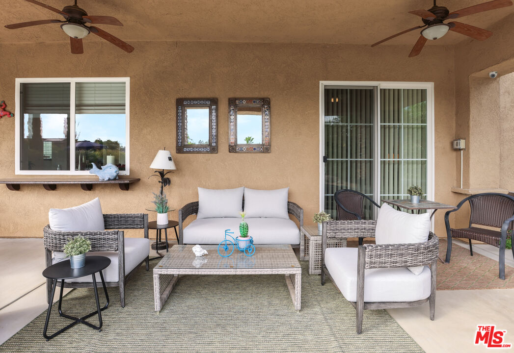 98 Via Santo Tomas Drive Rancho Mirage, CA 92270 - Photo 24 of 45 a living room with furniture and a window
