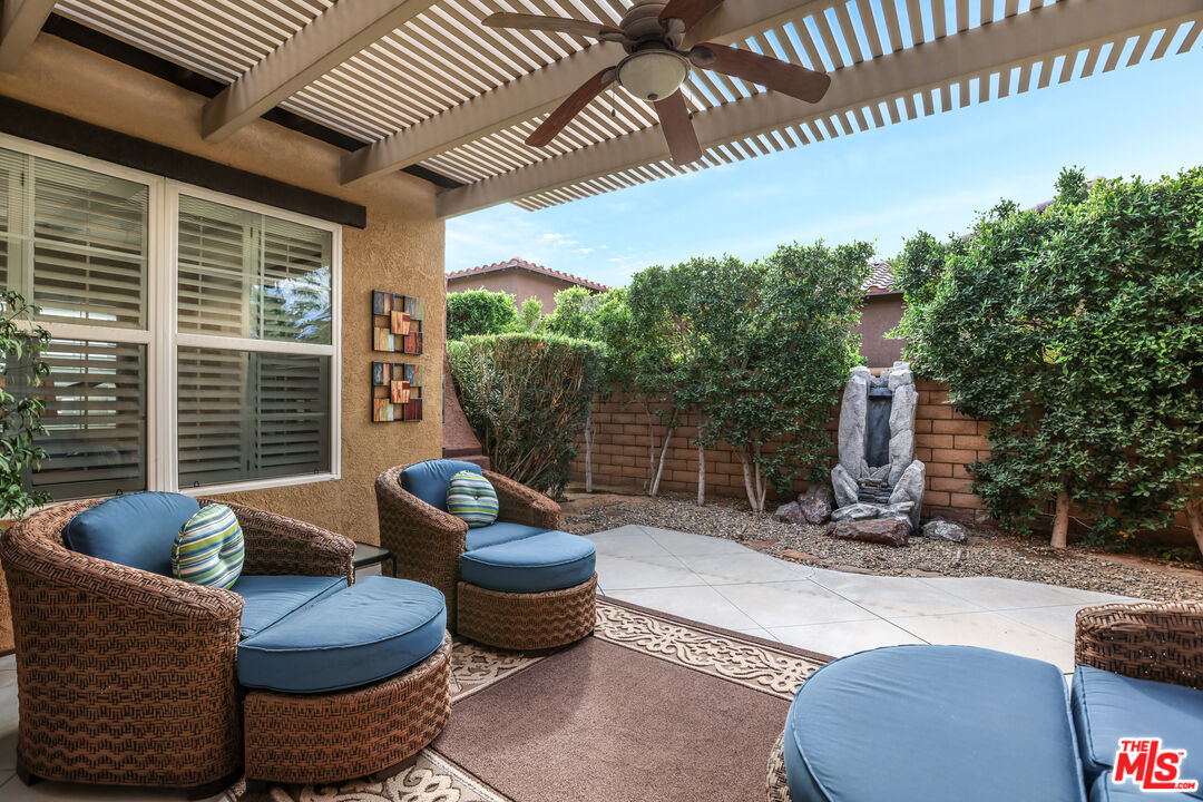 98 Via Santo Tomas Drive Rancho Mirage, CA 92270 - Photo 26 of 45 a living room with furniture and a potted plant