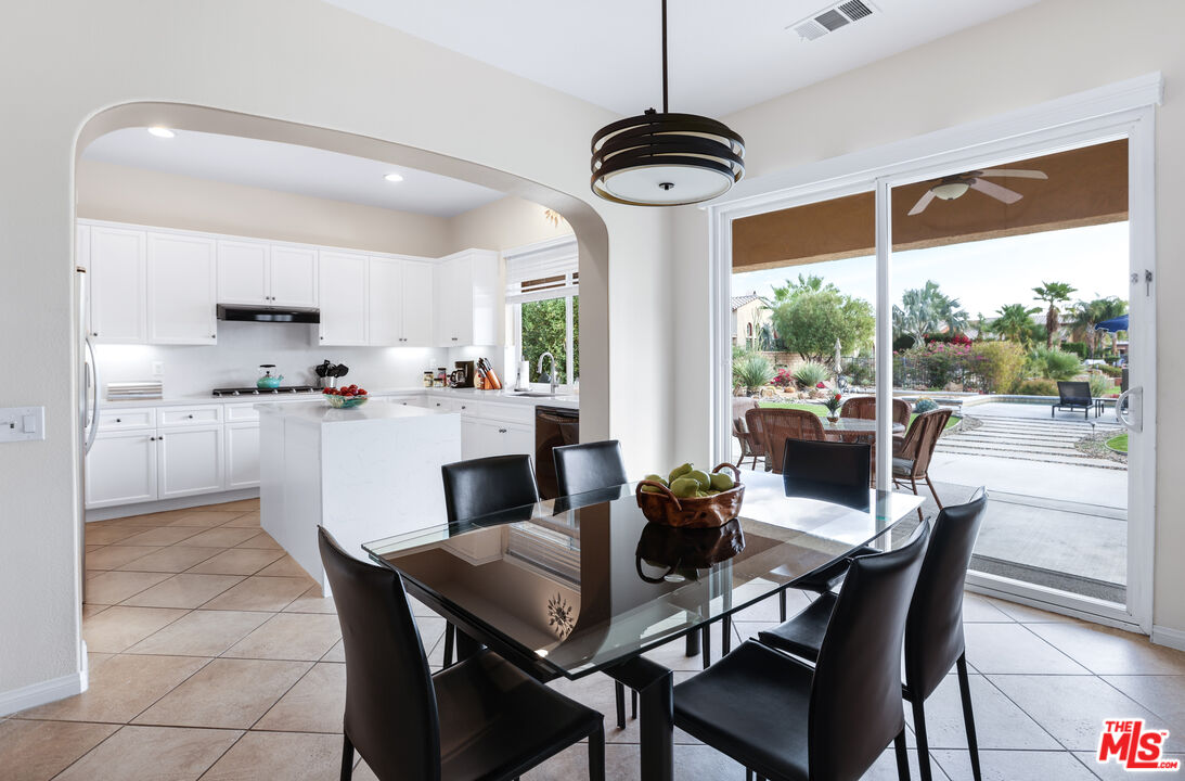 98 Via Santo Tomas Drive Rancho Mirage, CA 92270 - Photo 30 of 45 a view of a dining room with furniture window and outside view