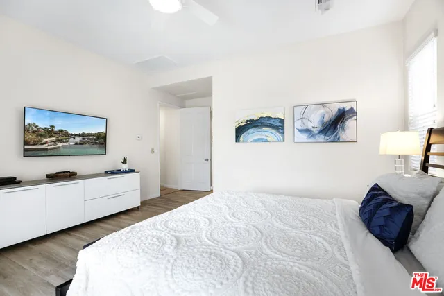 a bedroom with a bed and dresser