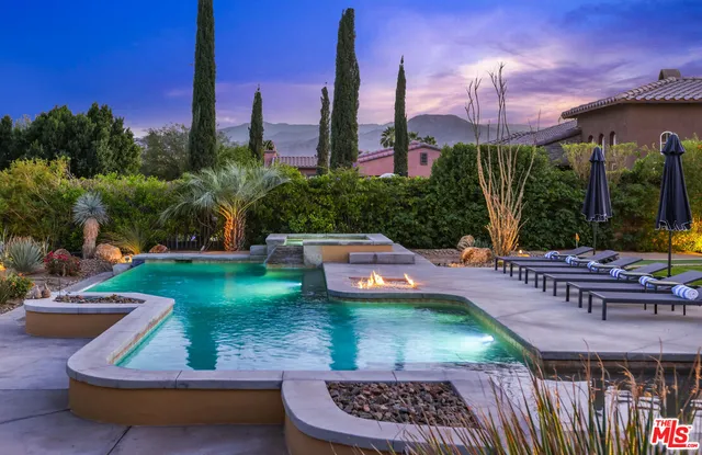 a view of a swimming pool with a patio