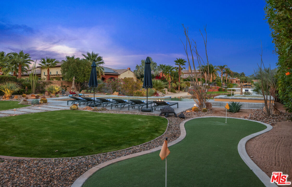 98 Via Santo Tomas Drive Rancho Mirage, CA 92270 - Photo 9 of 45 a view of a golf course with a garden