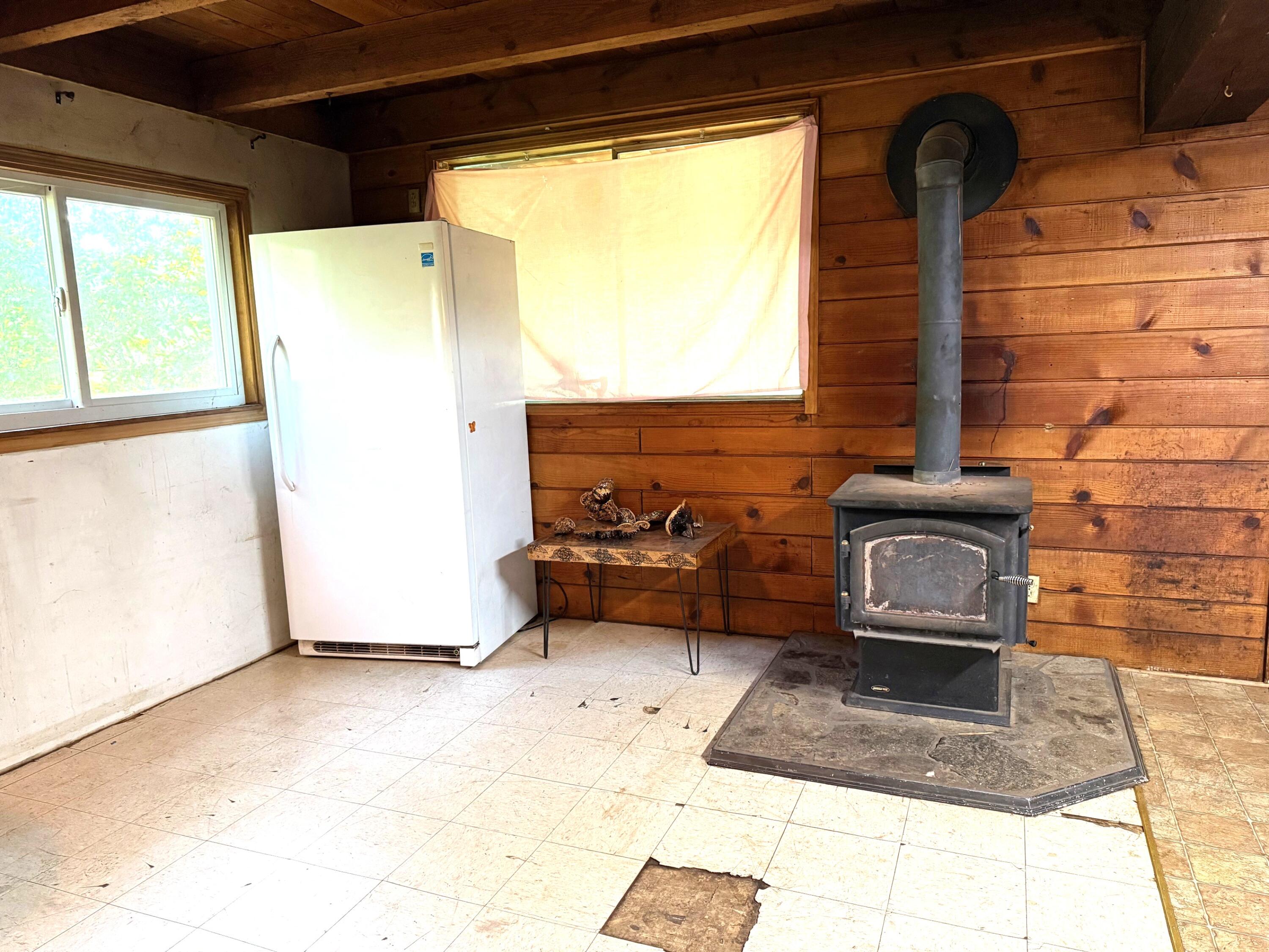 765 Lone Mountain Road O'Brien, OR 97534 - Photo 7 of 16 Eating area, kitchen and Living room are all in the same area of downstairs.