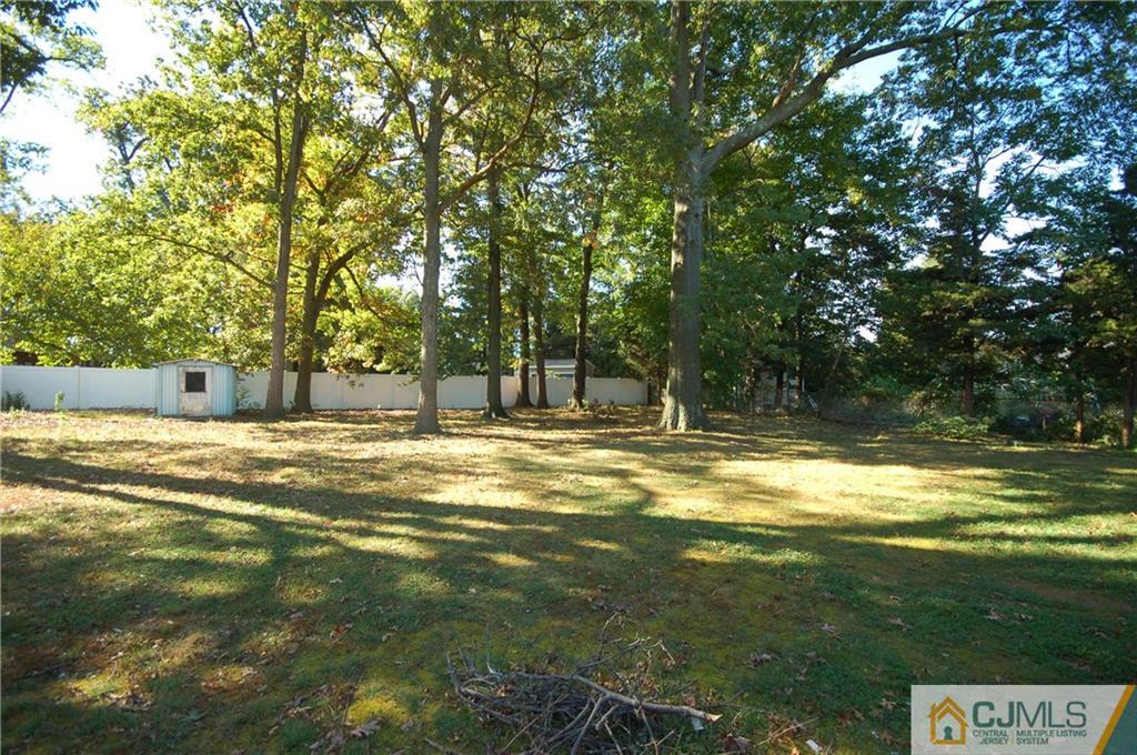 8 Estok Road Edison, NJ 08817 - Photo 22 of 22 a swimming pool with wooden fence