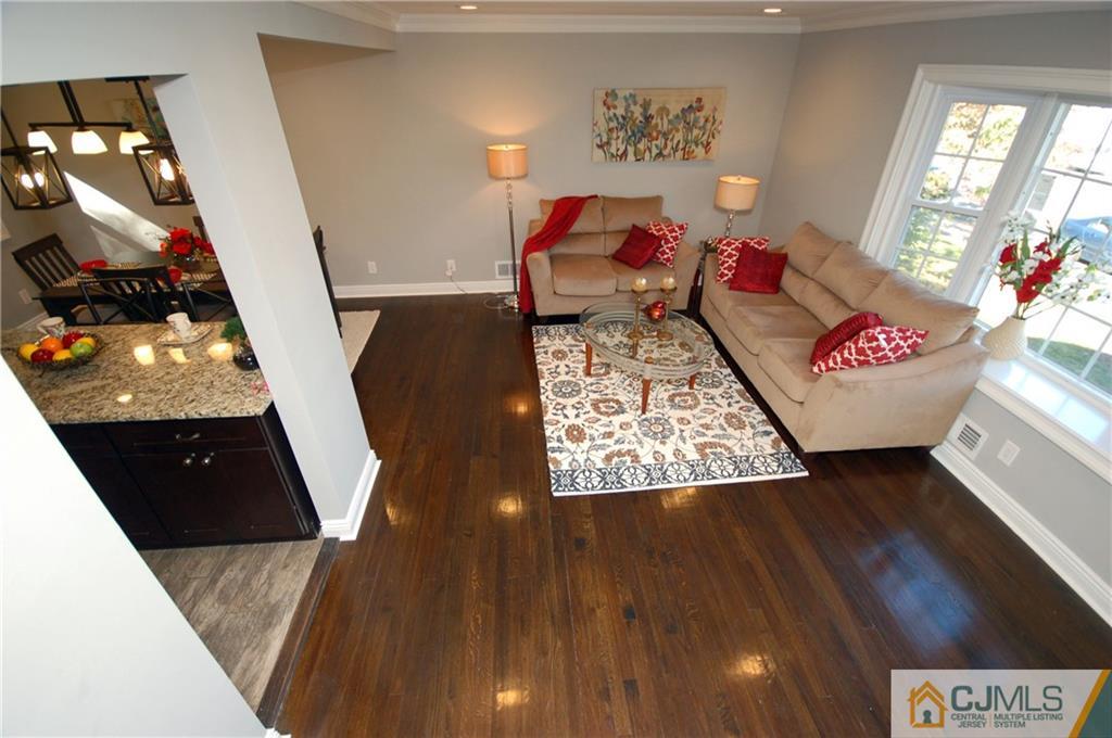 8 Estok Road Edison, NJ 08817 - Photo 7 of 22 a living room with wooden floor and furniture
