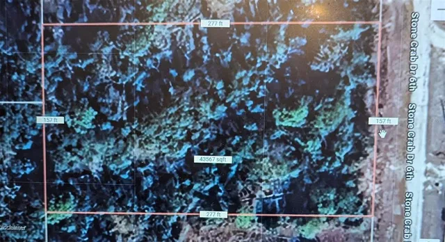 a view of a house with a tree