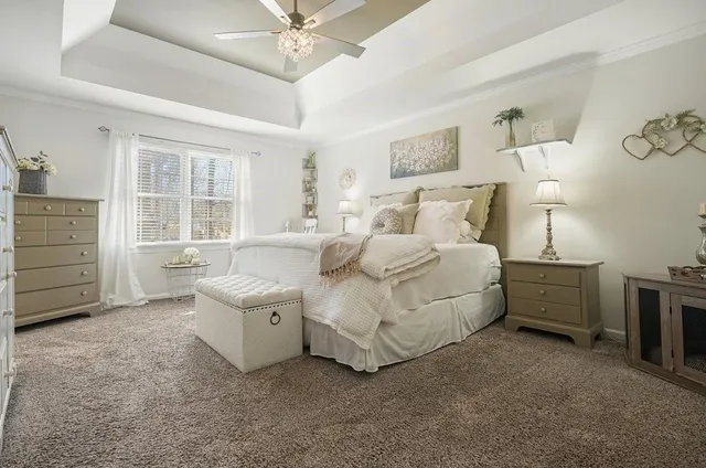 a spacious bathroom with double vanity sink a mirror and a bathtub