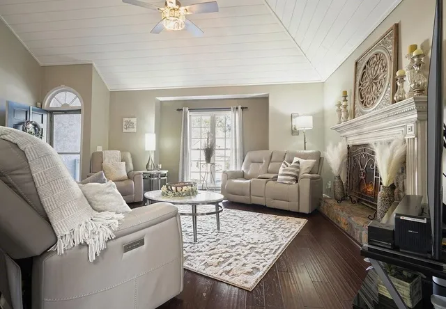 a view of a dining room with furniture a chandelier and wooden floor