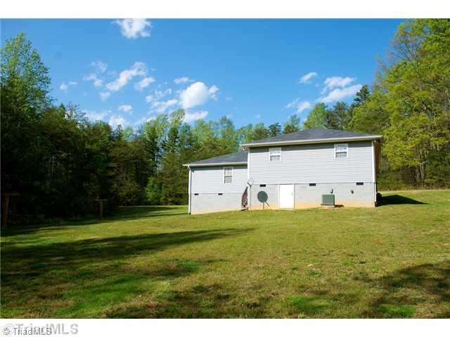 5754 Davis Road Walkertown, NC 27051 - Photo 15 of 16 Exterior Back. Great storage in the elevated crawlspace.