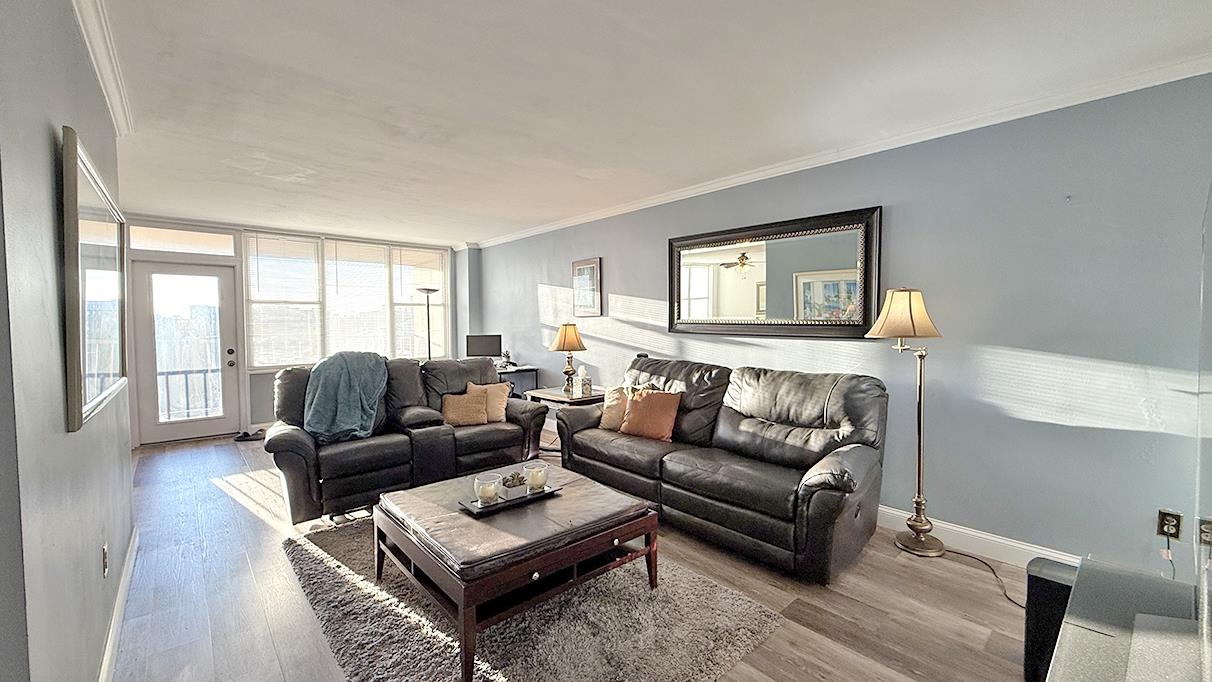 380 Mountain Road, Unit 714 Union City, NJ 07087 - Photo 2 of 31 a living room with furniture and a large window