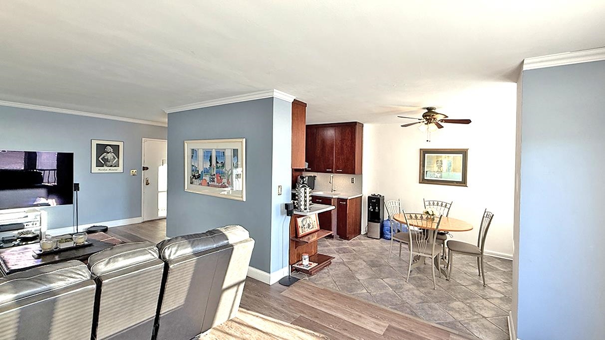 380 Mountain Road, Unit 714 Union City, NJ 07087 - Photo 4 of 31 a living room with furniture a flat screen tv and a table