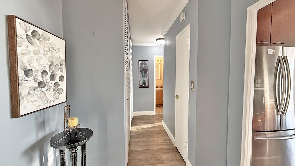 380 Mountain Road, Unit 714 Union City, NJ 07087 - Photo 8 of 31 a view of a hallway with wooden floor and entryway