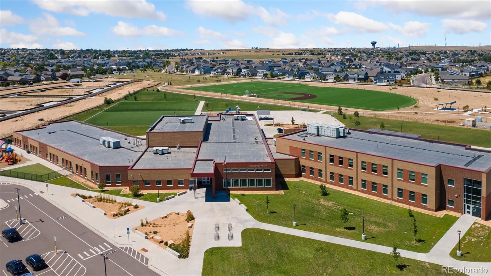 5540 Juniper Drive Brighton, CO 80601 - Photo 39 of 41 an aerial view of a house with a garden and lake view