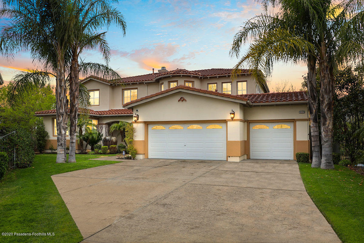 11171 Provence Lane Tujunga, CA 91042 - Photo 1 of 1 a front view of a house with a garden and trees