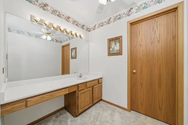 a spacious bathroom with a double vanity sink and a mirror