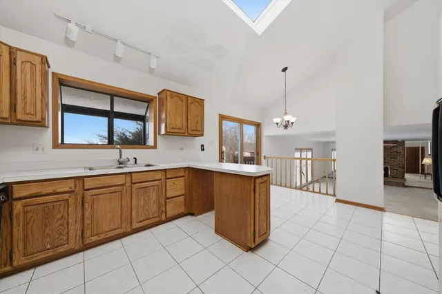 a kitchen with cabinets and sink
