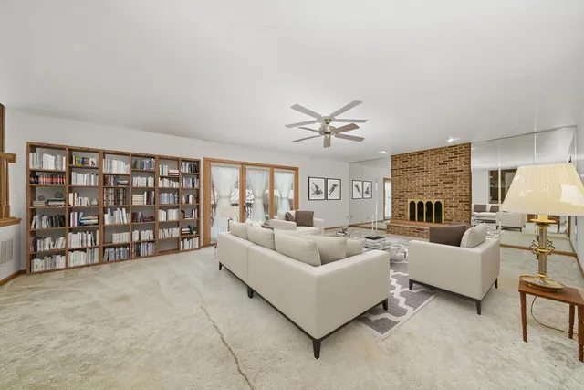 a living room with furniture and white walls