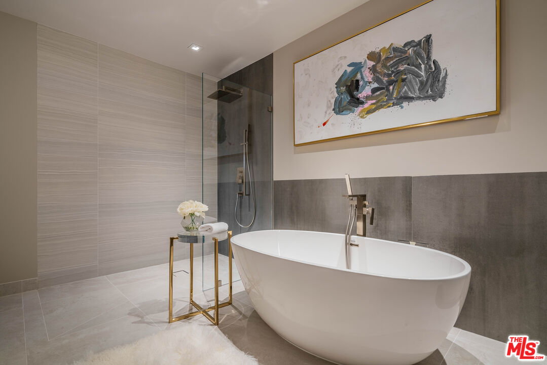 2391 Roscomare Road, Unit 401 Los Angeles, CA 90077 - Photo 12 of 22 a white bath tub sitting in a bathroom