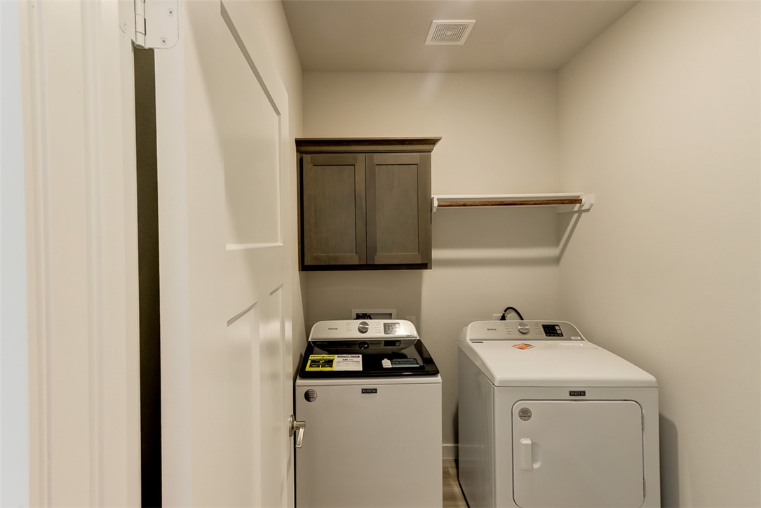 760 Double Mountain Road College Station, TX 77845 - Photo 23 of 26 a utility room with dryer and washer