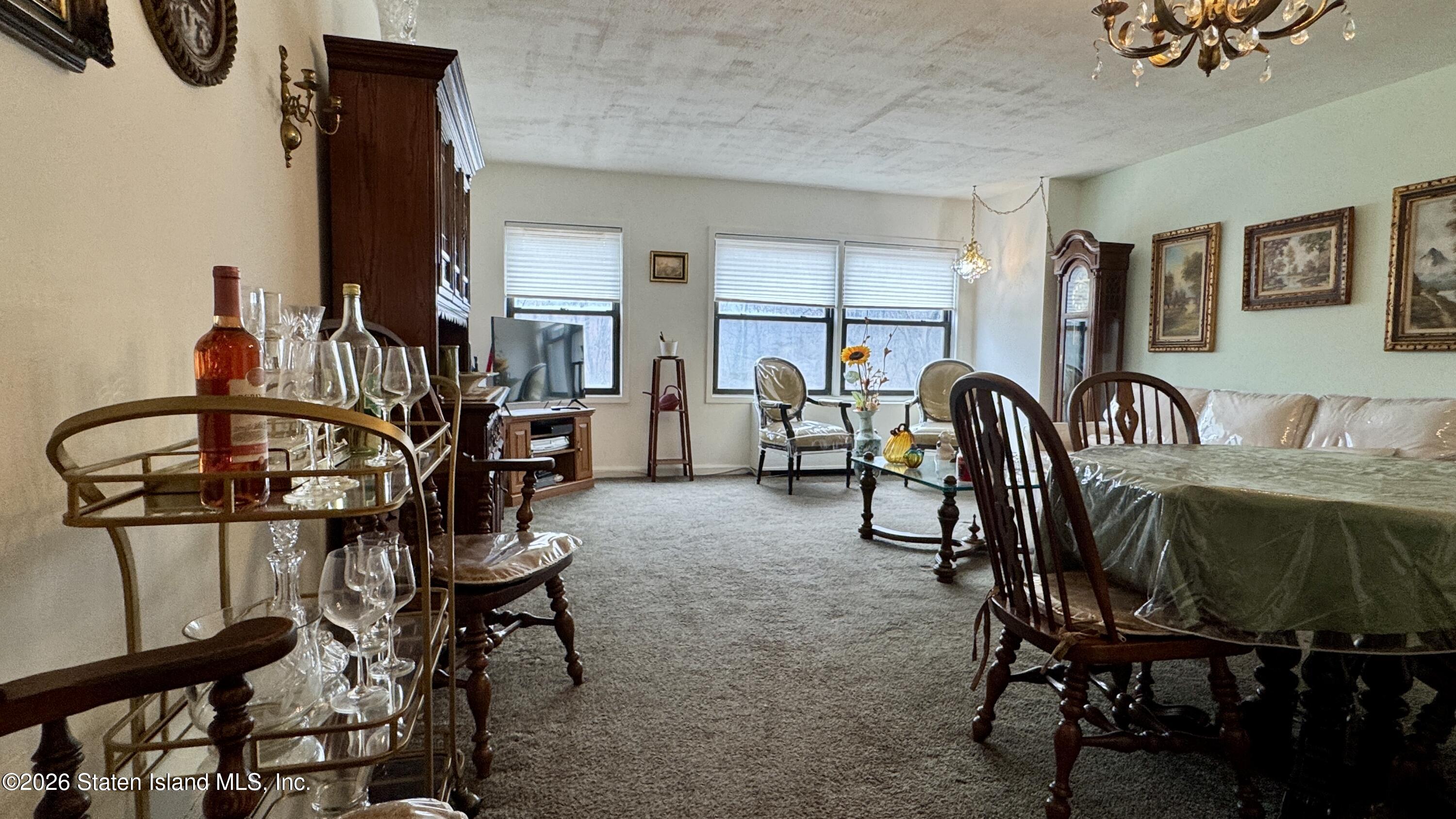 1100 Clove Road, Unit 2B Staten Island, NY 10301 - Photo 15 of 52 a view of a dining room with furniture