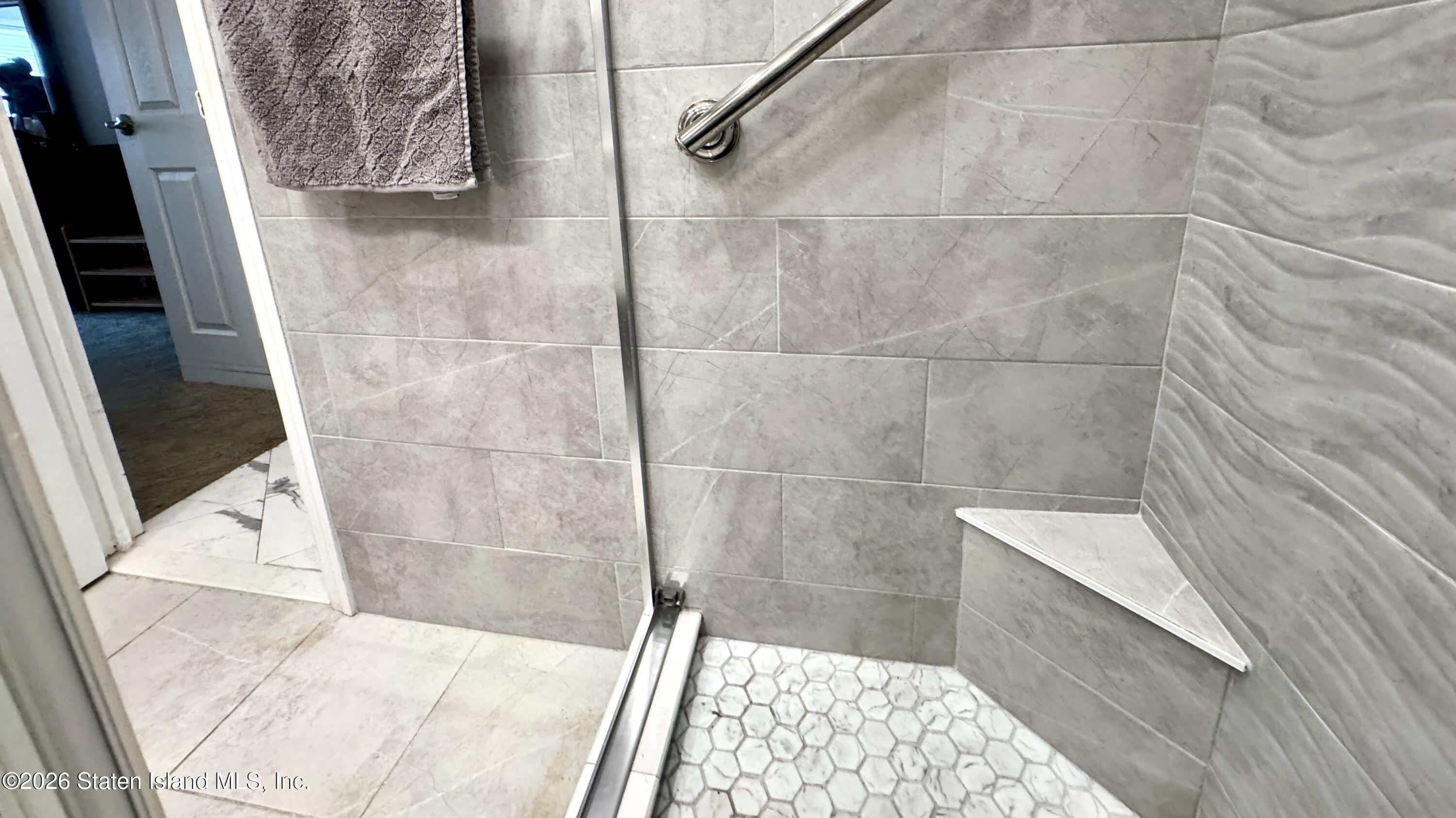 1100 Clove Road, Unit 2B Staten Island, NY 10301 - Photo 29 of 52 a bathroom with a shower