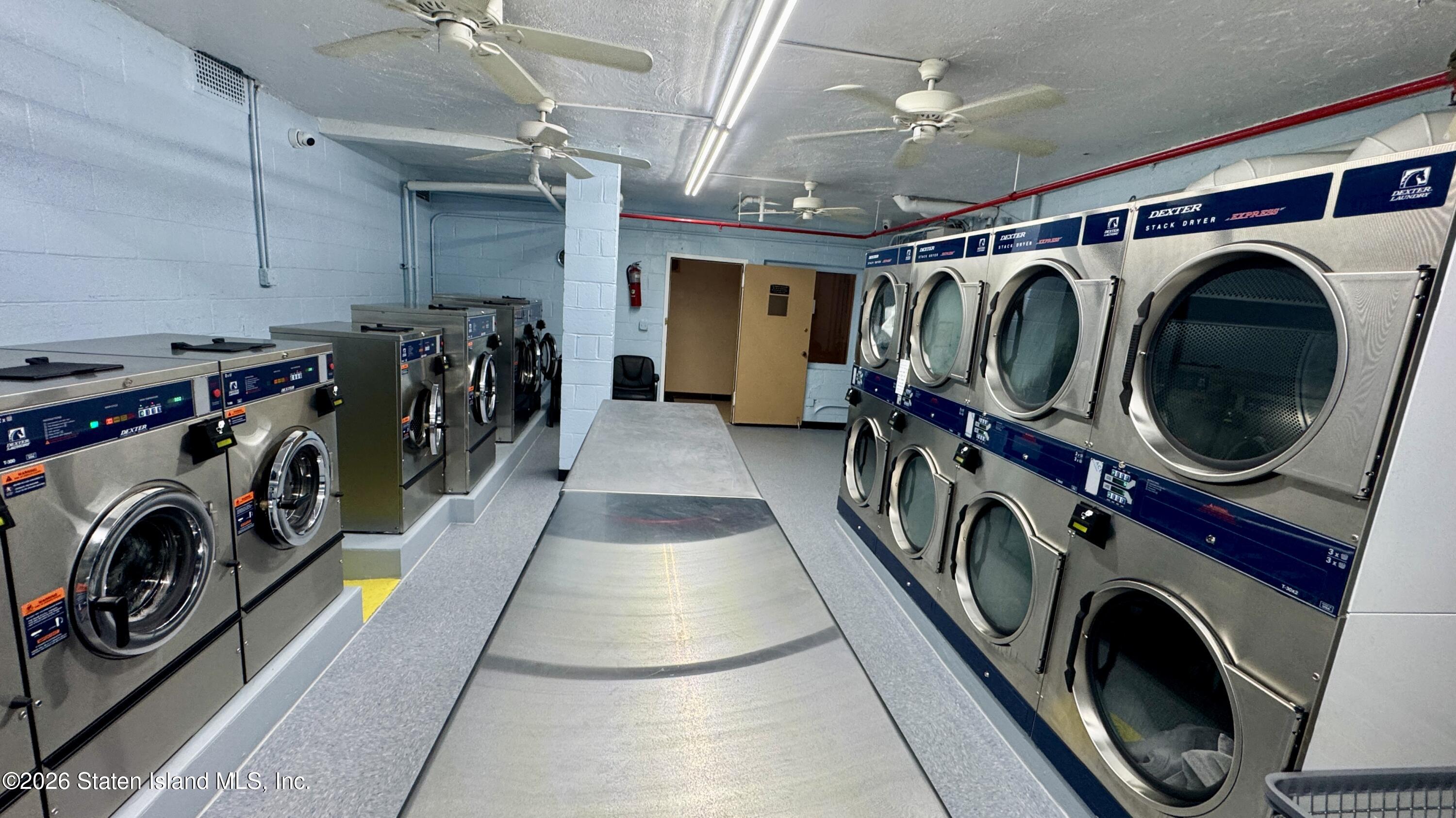 1100 Clove Road, Unit 2B Staten Island, NY 10301 - Photo 48 of 52 a utility room with dryer washer and a washer