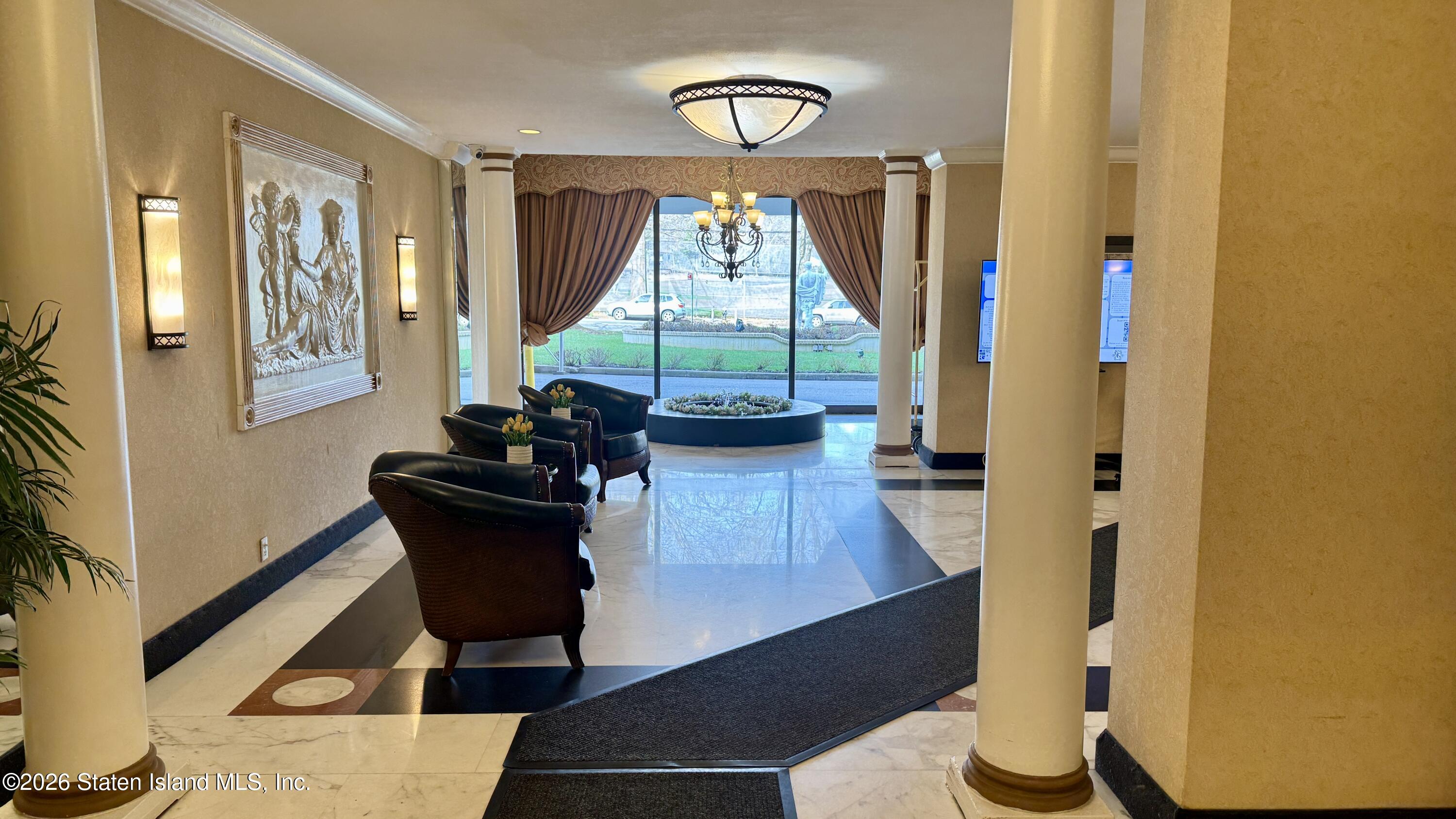 1100 Clove Road, Unit 2B Staten Island, NY 10301 - Photo 6 of 52 a living room with furniture and a window