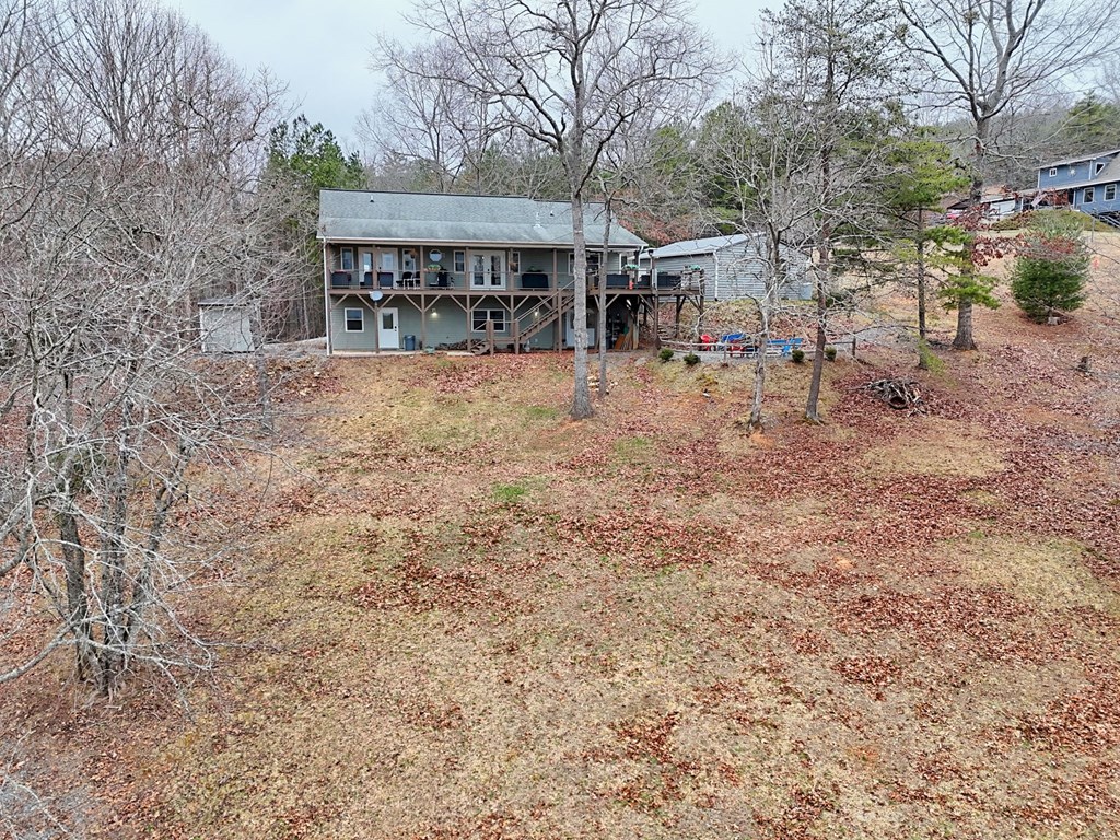 340 Country Mountain Ridge Drive Murphy, NC 28906 - Photo 11 of 73 a view of a chairs and table in the backyard