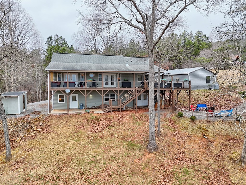 340 Country Mountain Ridge Drive Murphy, NC 28906 - Photo 12 of 73 a front view of a house with patio