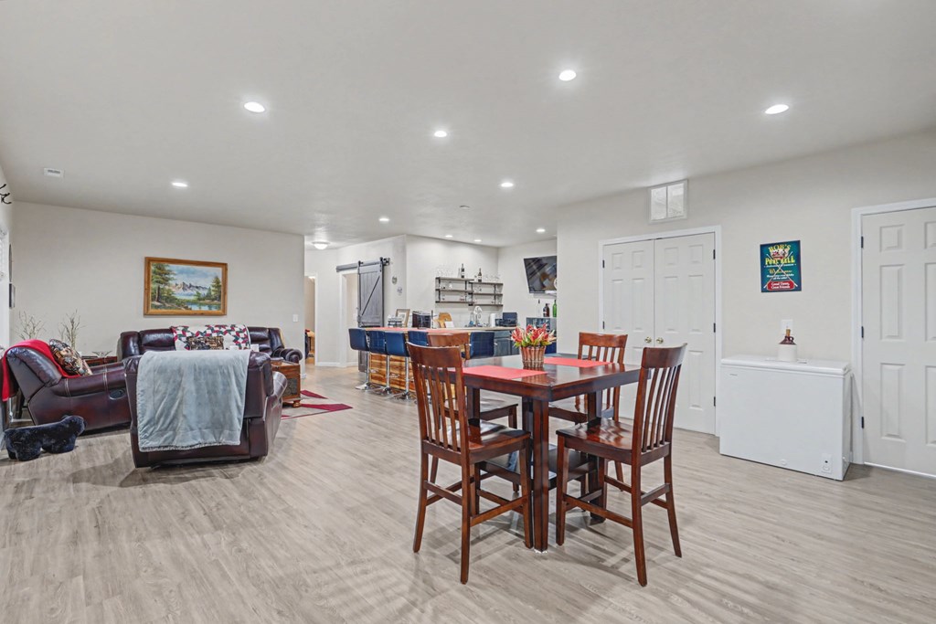 340 Country Mountain Ridge Drive Murphy, NC 28906 - Photo 14 of 73 a view of a dining room with furniture and wooden floor