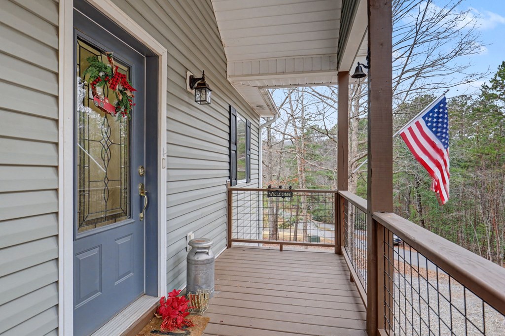 340 Country Mountain Ridge Drive Murphy, NC 28906 - Photo 26 of 73 a view of a balcony with wooden floor and stairs