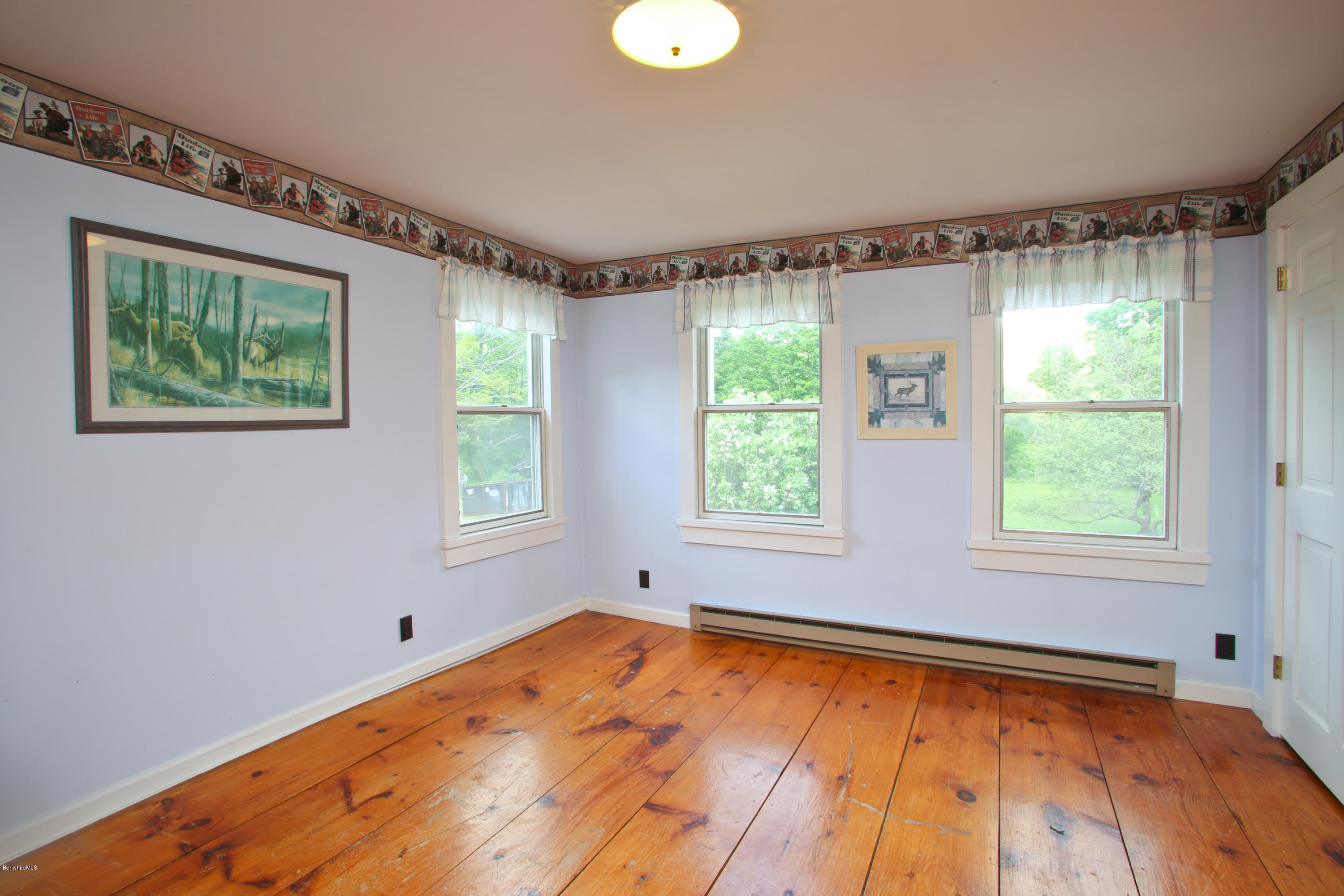 32 White Road Colrain, MA 01340 - Photo 19 of 34 a view of an empty room with a window and wooden floor