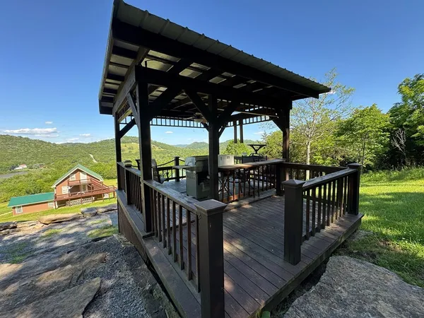 a view of a wooden deck with a yard