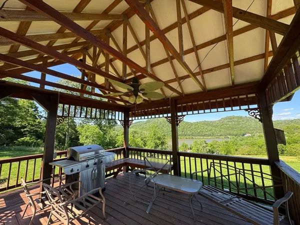 a view of balcony with wooden floor