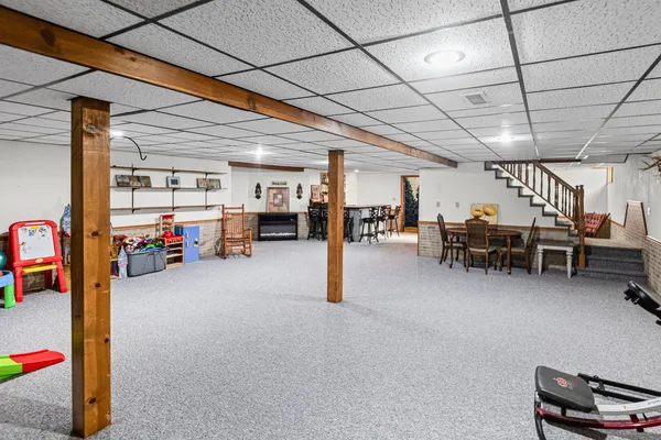 a view of a livingroom with furniture and a flat screen tv