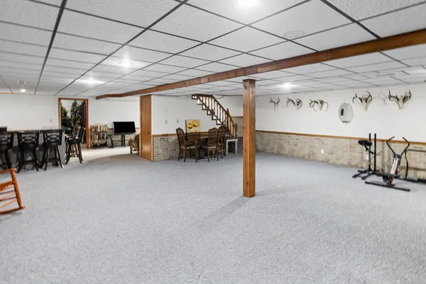 a bedroom with a bed and a view of closet