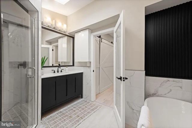 a en suite bathroom with a sink and a mirror