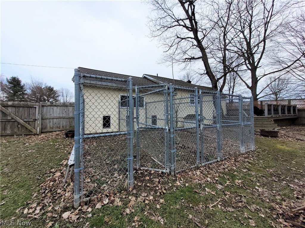 9021 Johnnycake Ridge Road Mentor, OH 44060 - Photo 29 of 32 3 chain link fence dog runs off the garage.