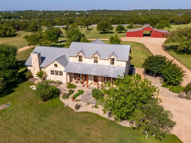 an aerial view of a house with a garden