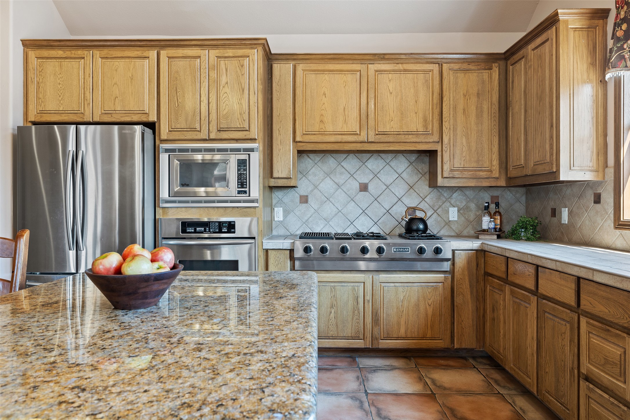 1120 Canyon View Road Dripping Springs, TX 78620 - Photo 13 of 40 a kitchen with stainless steel appliances granite countertop a stove a sink and a refrigerator