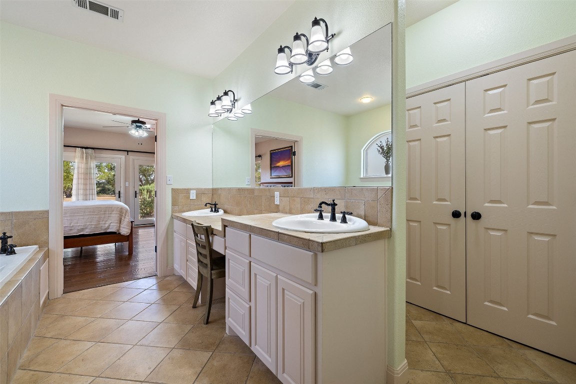 1120 Canyon View Road Dripping Springs, TX 78620 - Photo 17 of 40 a view of kitchen with sink and refrigerator