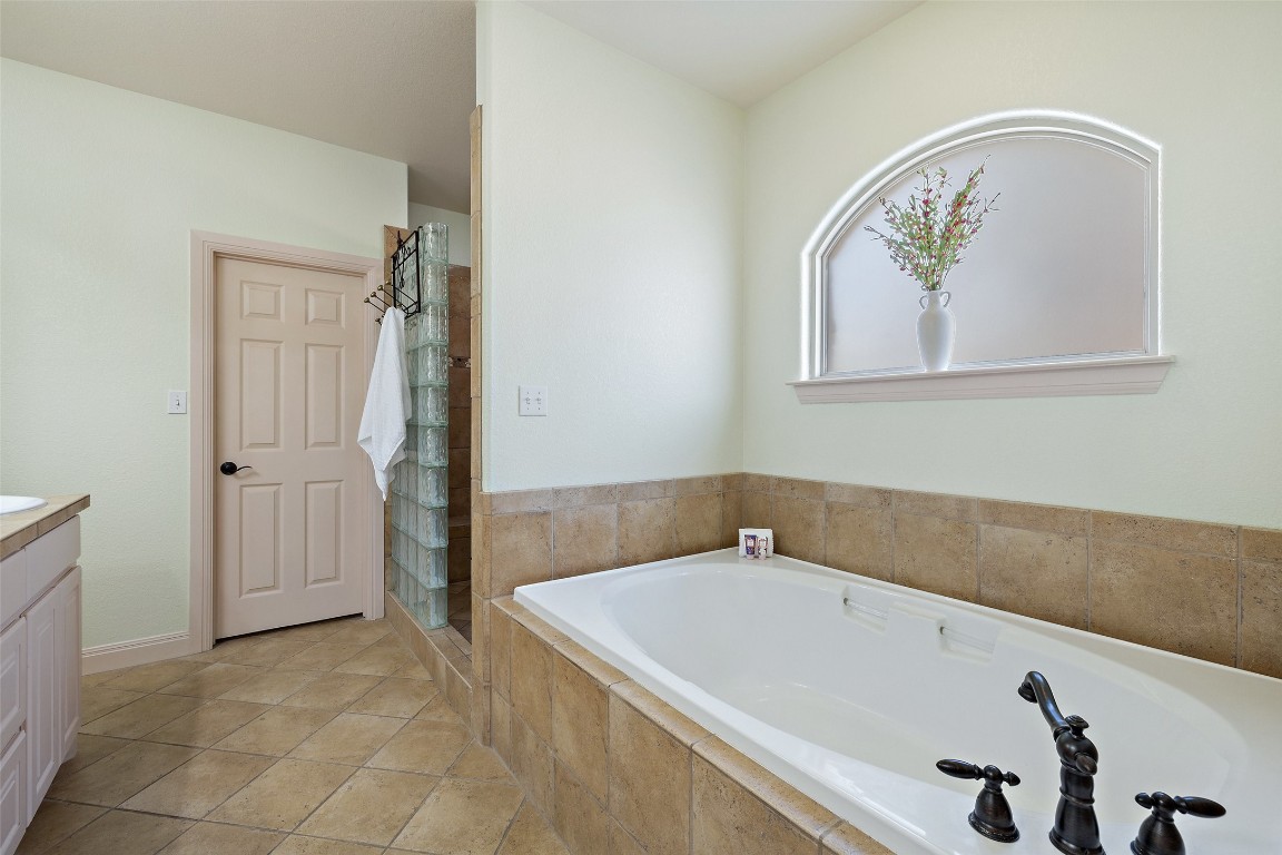 1120 Canyon View Road Dripping Springs, TX 78620 - Photo 18 of 40 a bathroom with a tub and shower