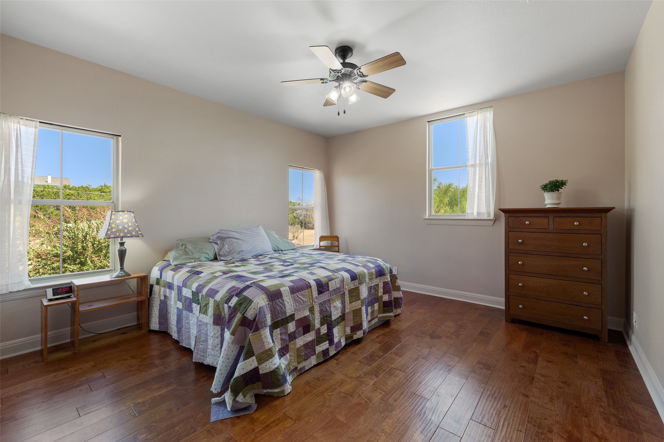1120 Canyon View Road Dripping Springs, TX 78620 - Photo 21 of 40 a bedroom with a bed and a dresser