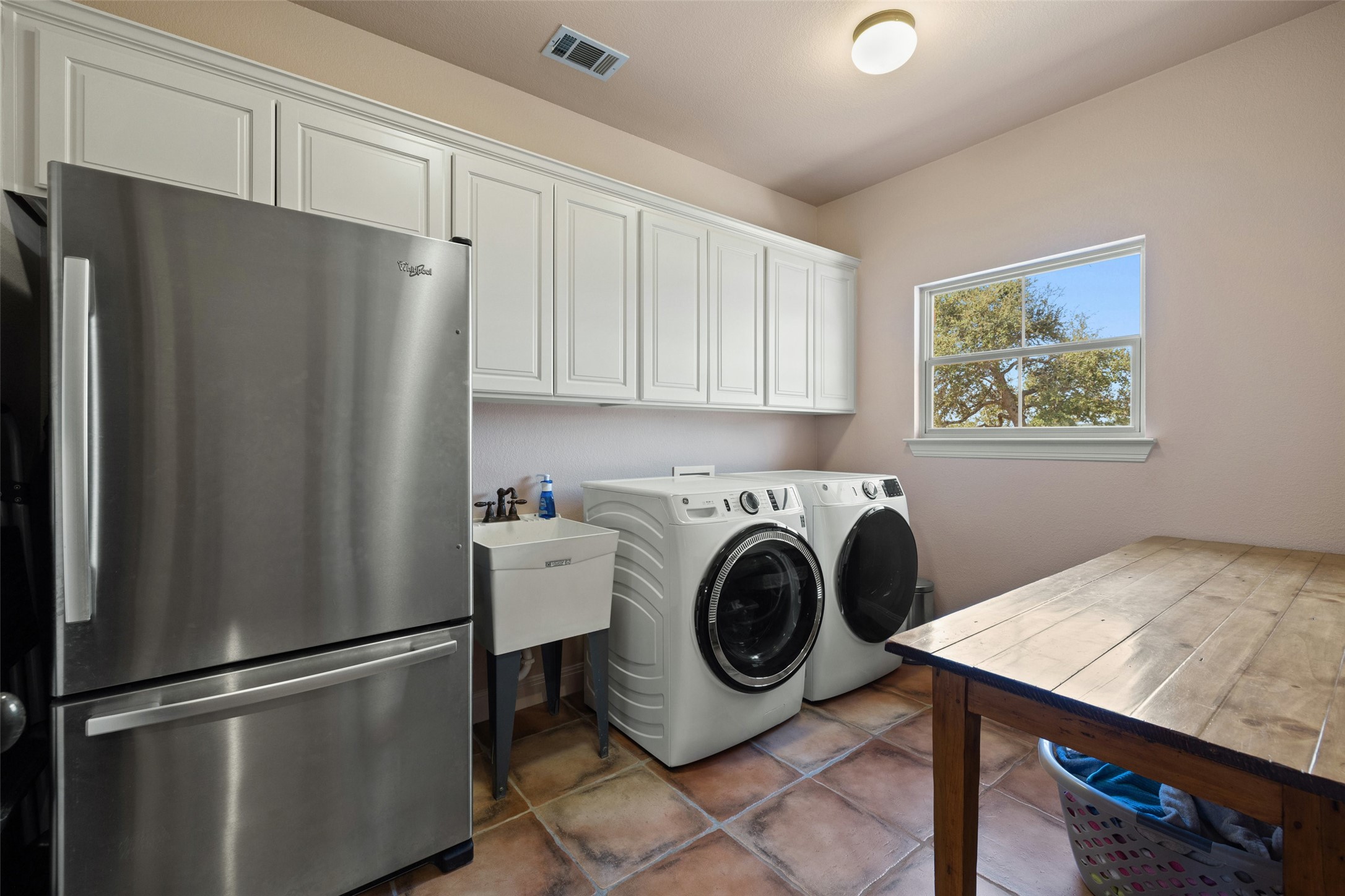 1120 Canyon View Road Dripping Springs, TX 78620 - Photo 23 of 40 a utility room with dryer and washer